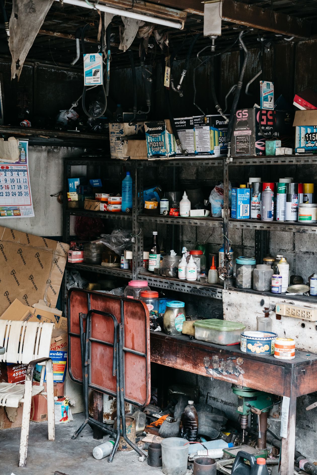 Cluttered garage before junk cleanout in Sudbury